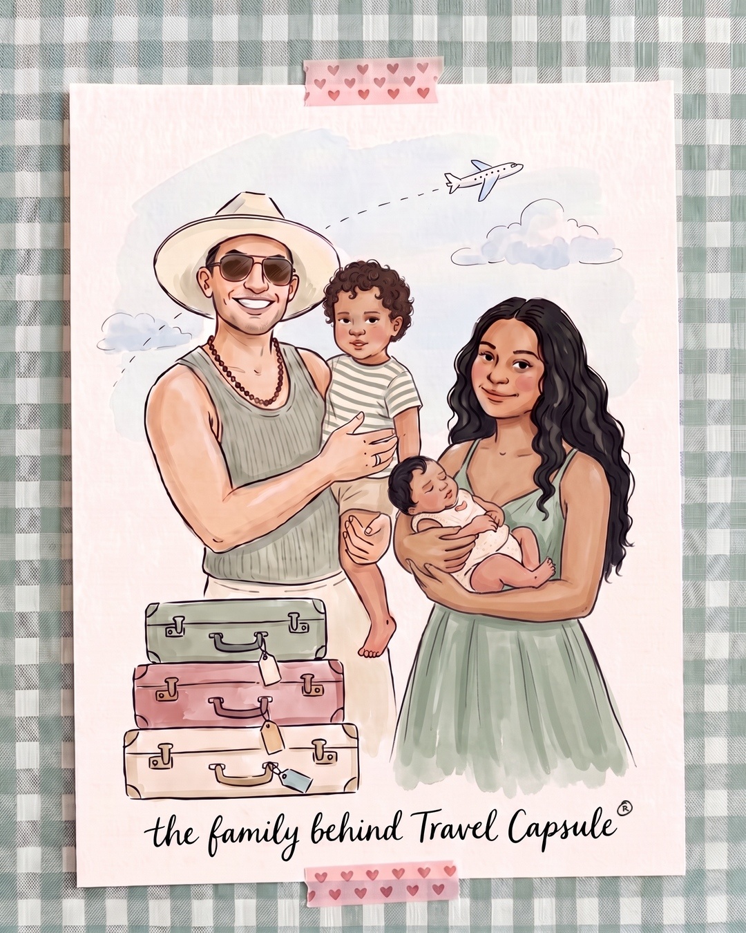 Hand-drawn ink and watercolor portrait of our family: a smiling father in a sun hat and sunglasses holds our curly-haired toddler son in a striped tee, and a mother with long wavy black hair in a sage green summer dress cradles our sleeping newborn daughter, beside a stack of sage, rose and cream suitcases with an airplane overhead. Handwritten text reads "the family behind Travel Capsule®".